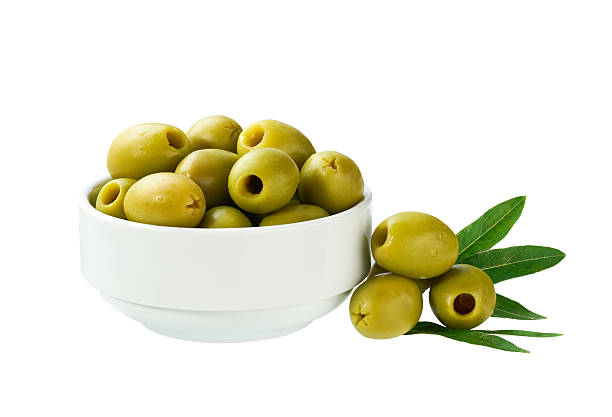 istock Ceramic  bowl with pickled pitted green olives isolated on a white background. 2243001081