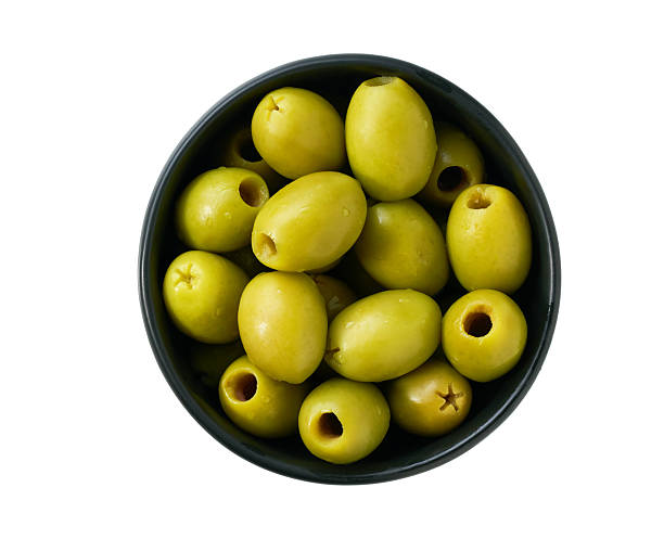 istock pitted olives in a black ceramic bowl isolated on a white background, top view. 2243001125