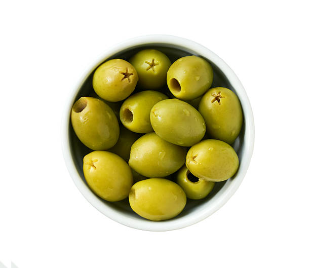 istock pitted green olives in a white ceramic bowl isolated on a white background, top view. 2243001138