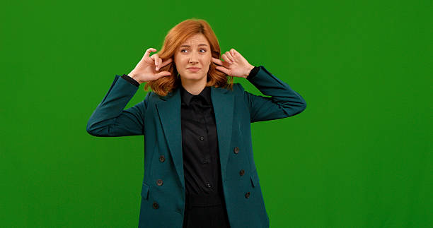 Woman expresses different gestures in a studio with green background