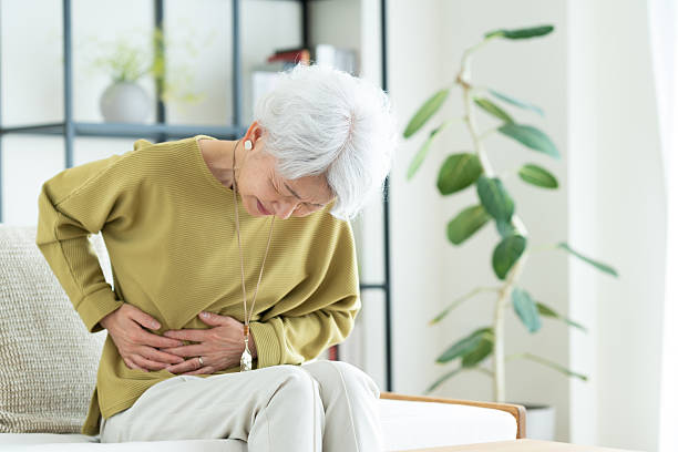 istock Senior woman with stomachache 2243001679