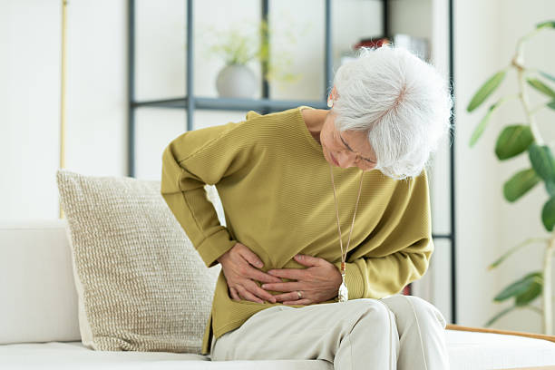 istock Senior woman with stomachache 2243001693