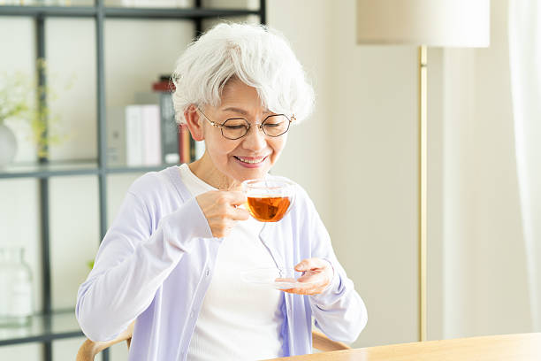 istock Senior woman drinking tea 2243002629