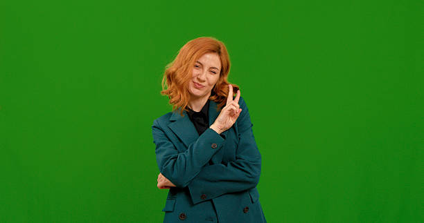 istock Woman demonstrates various gestures against a green background 2243003205