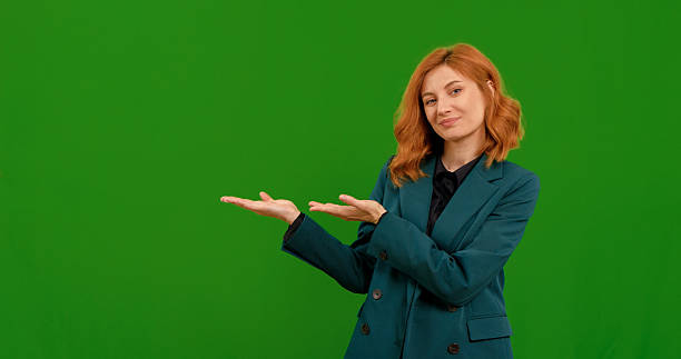 istock Woman shows gestures professionally against a green backdrop 2243003896