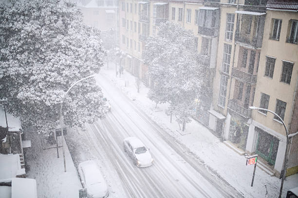 A city street during snowfall