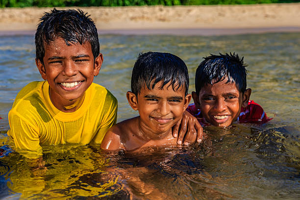 Sri Lankan young boy having fun in the sea, Sri Lanka