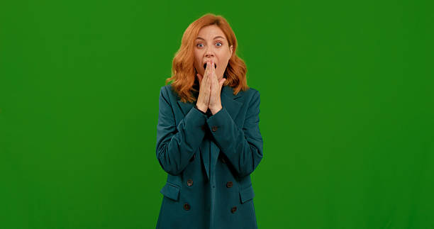 istock Very surprised female with shocked wow face expression on green screen background. 2243006064