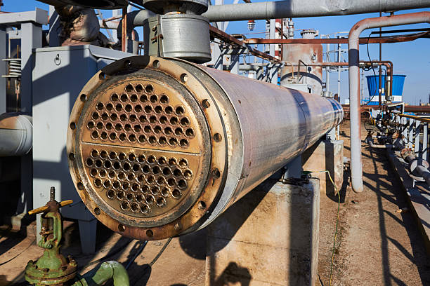 Industrial heat exchanger or boiler tubes bundle. Two way heat exchanger shell and tubes opened for repairing and deposits cleaning at petrochemical enterprises industrial background with copy space.