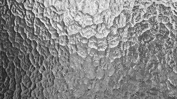 istock Textured stainless steel metallic gray silver hammer tone abstract embossed metal surface pattern background 2243006812