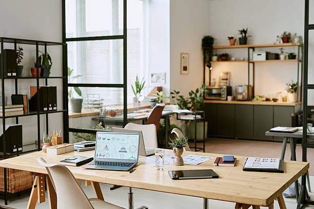 istock Contemporary Office Desk Showcasing Laptop Presenting Financial Graphs 2243007676