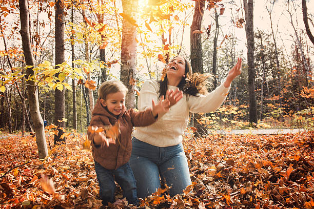 istock young mother with son in autumn in beautiful forest 2243007754