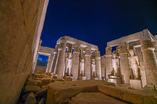 istock Illuminated Ancient Statues and Columns at Luxor Temple Egypt at Night. 2243008233