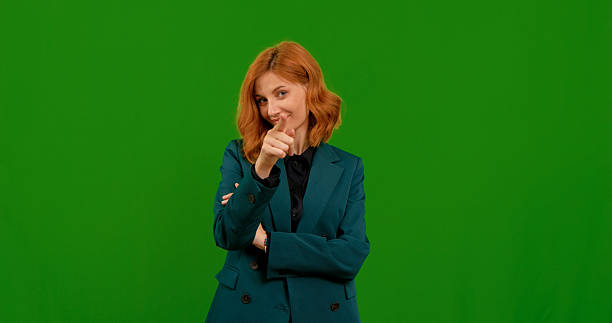 istock Woman demonstrates various gestures in a bright green setting 2243008540