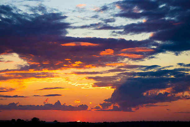 istock Red-orange sunset on a dark cloudy sky 2243009368