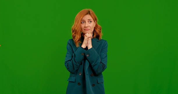 Woman shows different gestures in front of a green background