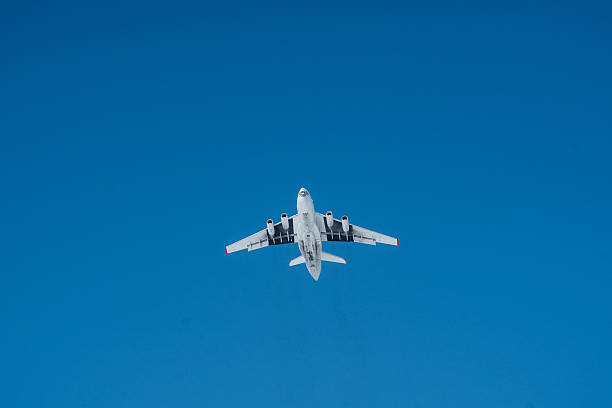 istock A bright white airplane is soaring gracefully through a beautifully clear blue sky on a lovely, sunny day, showcasing the wonders of aviation and air travel. Its a magnificent sight 2243010805