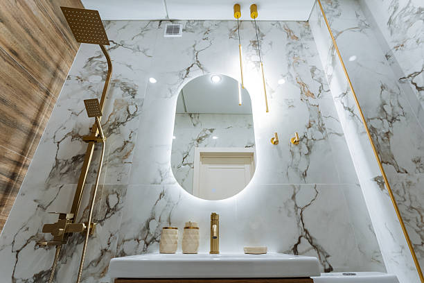 istock The bathroom features essential elements including a stylish sink, a wellplaced mirror, and an overhead shower head, creating a functional yet aesthetically pleasing space 2243010980