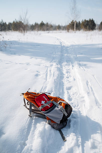istock A brightly colored backpack rests atop the undisturbed white snow next to a welltrodden hiking trail on a brisk and chilly winter day, amidst the tranquil and stunning beauty of the season 2243010981