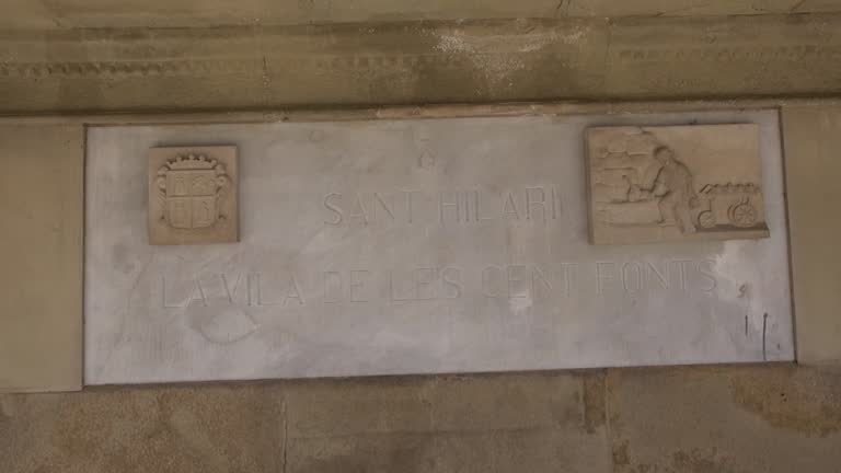 Sant Hilari Sacalm fountain village sign emblem marble stone