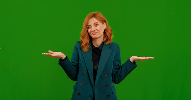 istock Woman makes various gestures in front of a green screen background 2243011851
