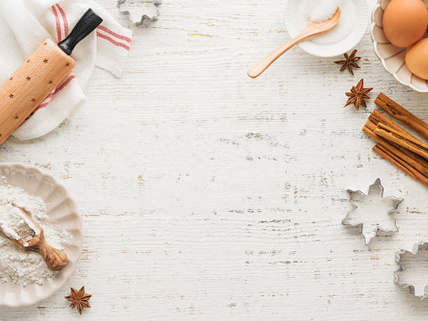 Culinary background with Ingredients for cooking Christmas baking on old white wooden background table. Top view. Christmas holiday kitchen background. Design element.
