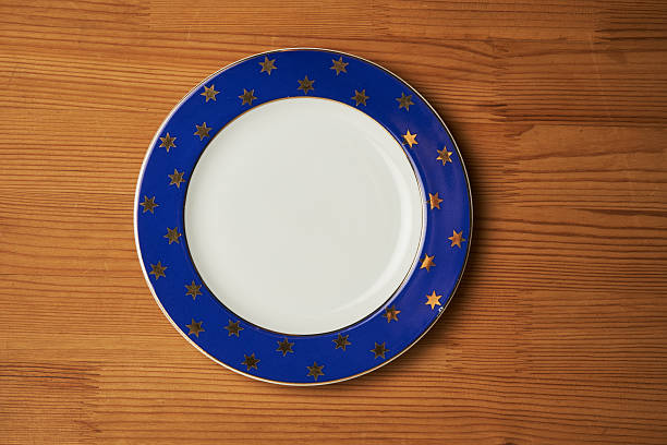 istock Top view of empty plate on wooden background. 2243013049