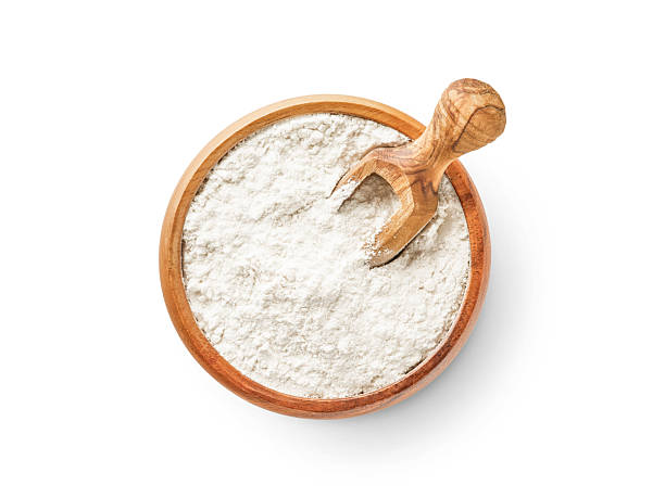 istock Wheat flour in wooden bowl with spoon isolated on white background with clipping path. 2243013083