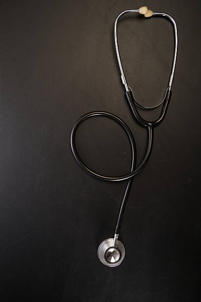 full length of stethoscope against chalkboard.