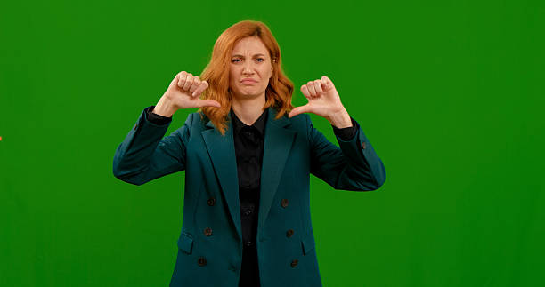 istock Thumbs down showed by woman and sad face 2243014193
