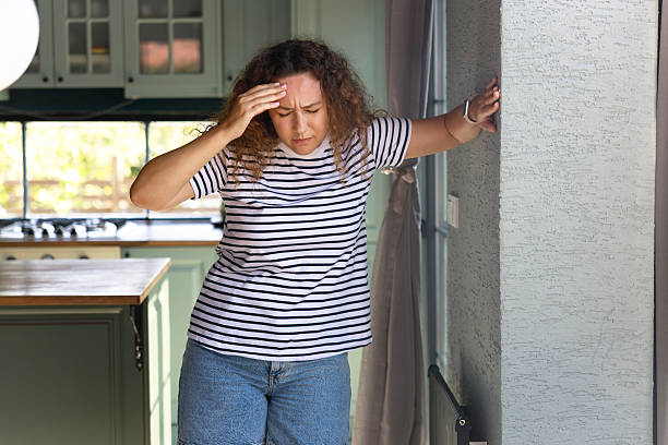 istock Young woman suffering from vertigo or dizziness problem of brain or inner ear 2243014234