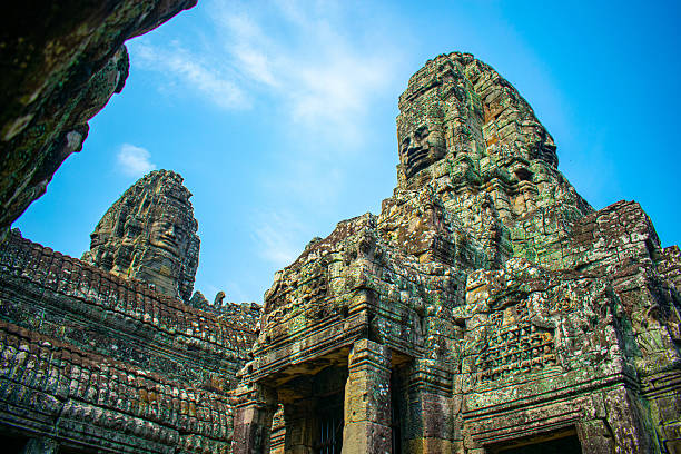 Angkor temple complex in Siem Reap, Cambodia, an ancient Khmer archaeological site and UNESCO World Heritage, photographed among jungle surroundings.
