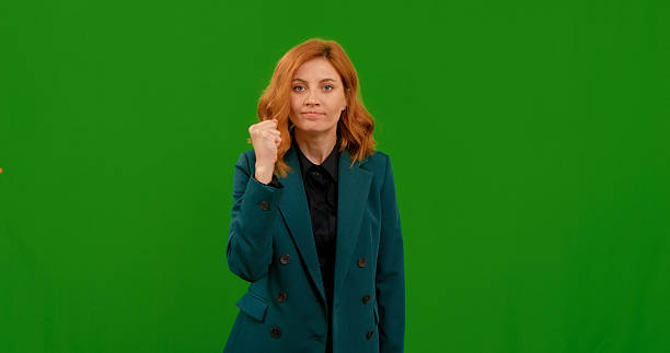 istock Woman displaying various gestures against green screen background 2243016266