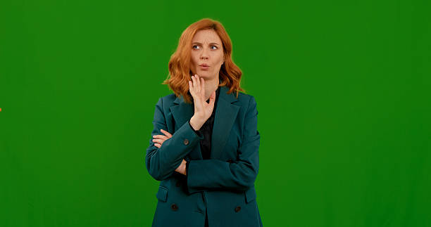 istock Woman demonstrating various gestures in front of a green screen background 2243016467