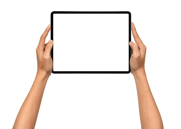 istock Close-up of hands holding a modern tablet with blank screen isolated on white background. High quality studio shot. Concept for technology, business, finance, advertising and public relations. 2243016802