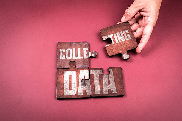 istock Hand placing puzzle piece to complete the words Collecting Data, concept of information analysis research and digital technology 2243016805