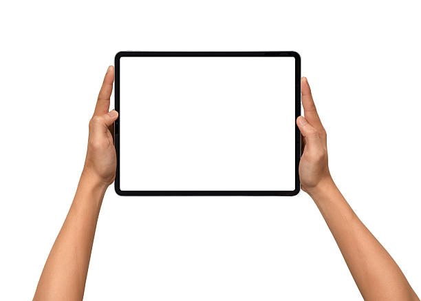 istock Close-up of hands holding a modern tablet with blank screen isolated on white background. High quality studio shot. Concept for technology, business, finance, advertising and public relations. 2243016831
