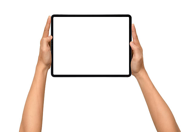 istock Close-up of hands holding a modern tablet with blank screen isolated on white background. High quality studio shot. Concept for technology, business, finance, advertising and public relations. 2243016836