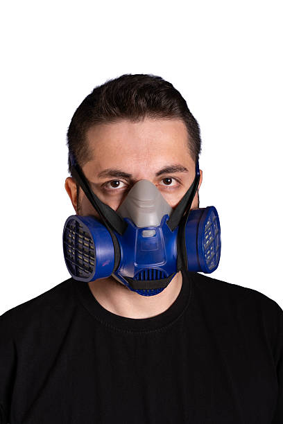 istock Young man wearing protective face mask covering nose and mouth 2243018808