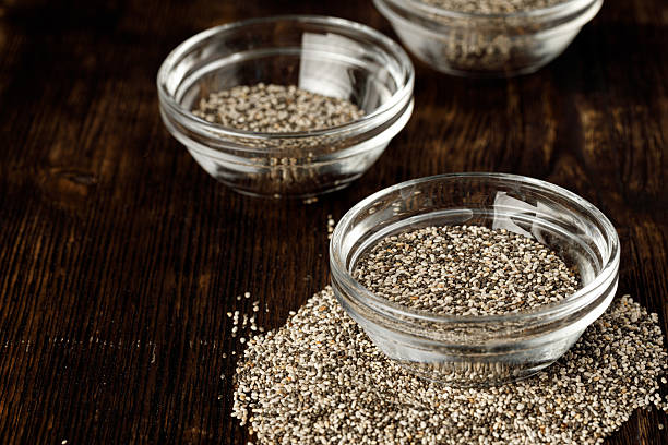istock Glass bowl with chia seeds on wooden table 2243019036