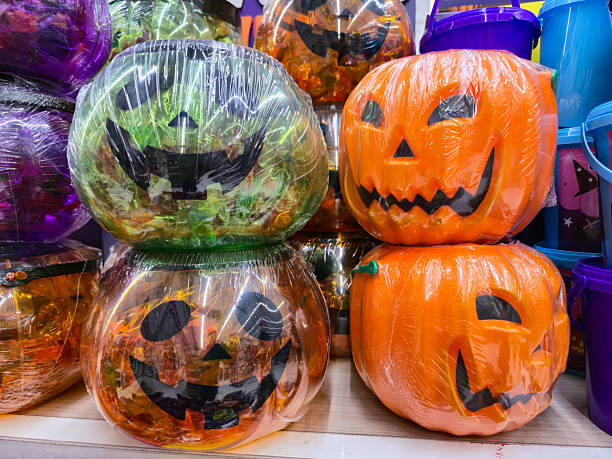 istock group of Halloween pumpkins filled with candy displayed for sale 2243020295