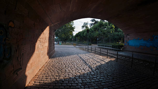 Interior view of a stone bridge with a walkway also made of stone