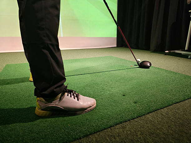 istock Golf swing practice session taking place indoors with a focus on foot 2243023183