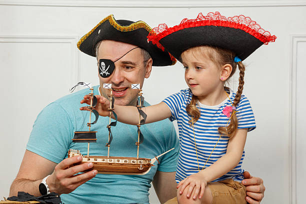 istock Dad and daughter bond over fun pirate-themed imaginative play 2243024621