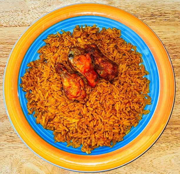 istock Savoury Jollof rice with crispy fried chicken. 2243024693