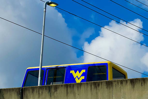 Morgantown, West Virginia, USA - October 20, 2025: A PRT car autonomously runs on an elevated concrete track through West Virginia University’s Evandsdale Campus.