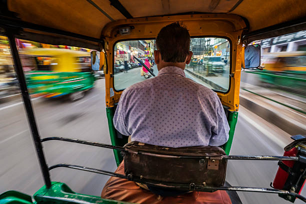 istock Indian man drives auto rickshaw (tuk-tuk), India 2243026959