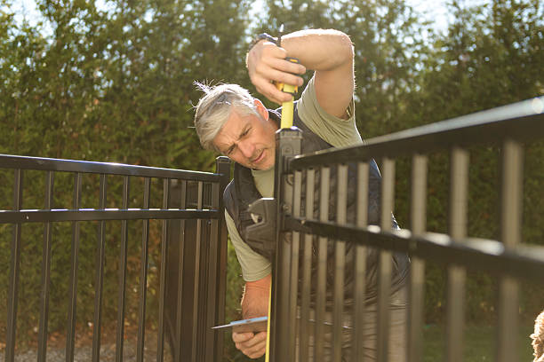 istock A Safety fence with worker inspection take measure men 2243028650