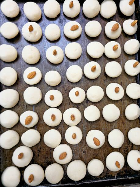 istock Freshly baked nankhatai cookies with almonds arranged on baking tray 2243028809