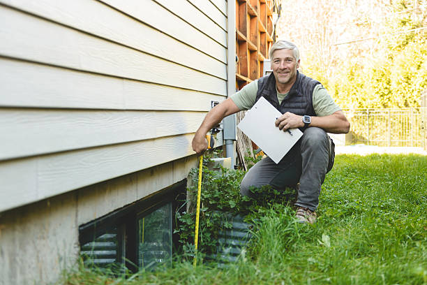 istock inspector or engineer is checking the building structure and house. After the renovate is complete 2243029728